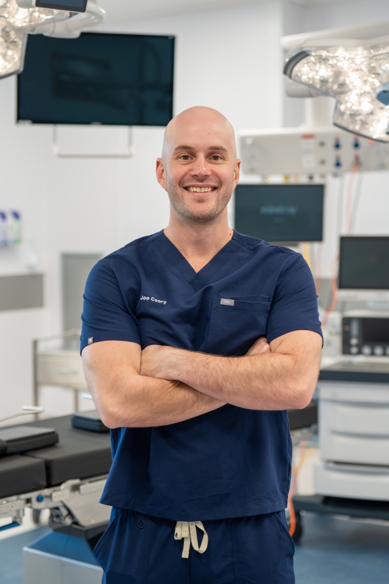 Dr Joe Coory in surgical scrubs