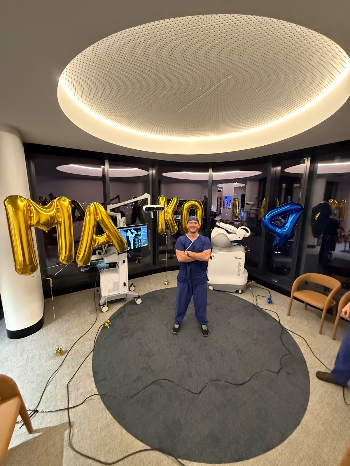 Dr Joe Coory beside the Mako 4 robotic arm at Maroochy Private Hospital after the first Mako 4 shoulder replacement in Australia, 1 October 2026